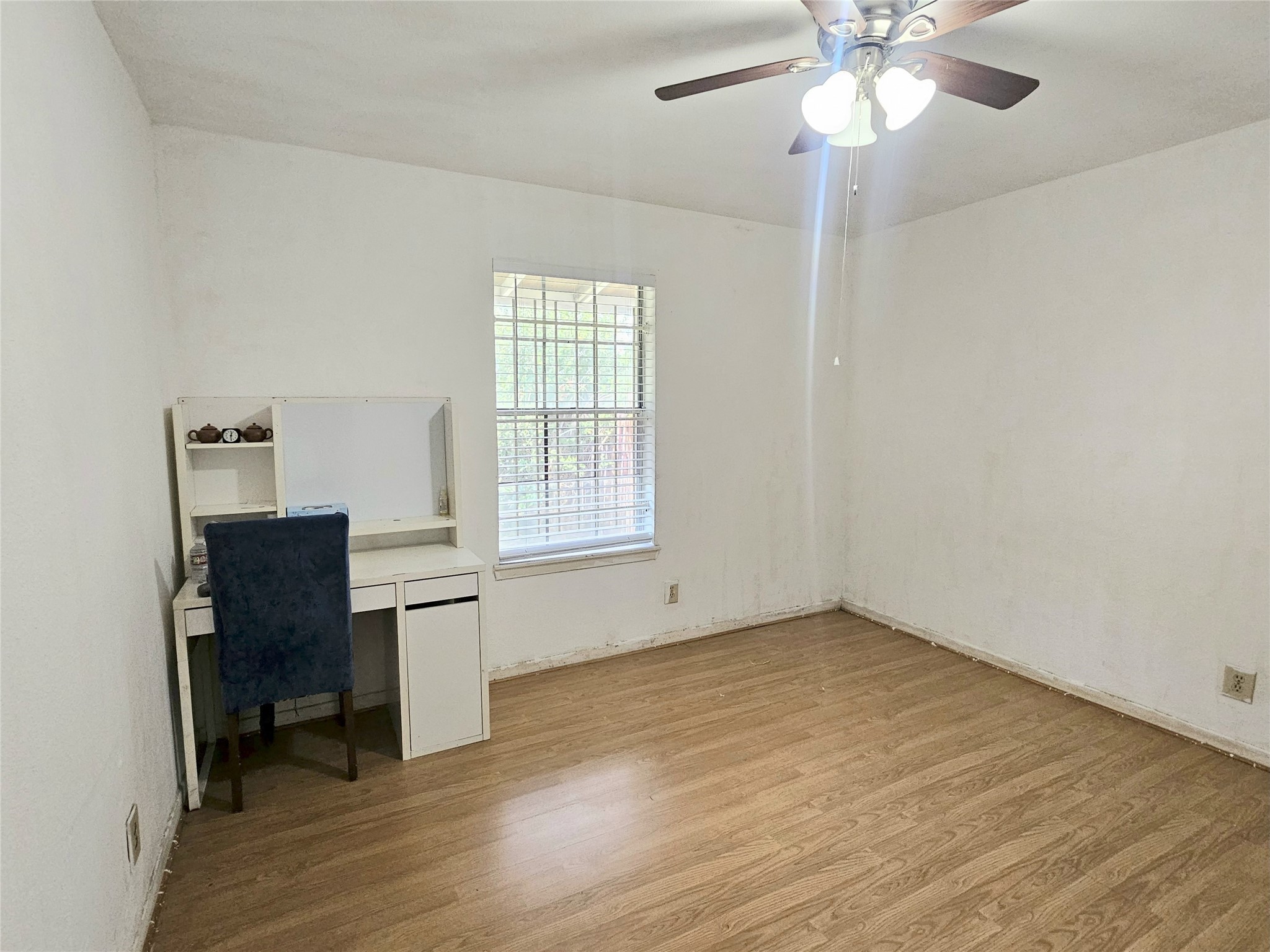 6201 Ranchester Drive, Unit 1 Houston, TX 77036 - Photo 10 of 26 wooden floor in an empty room with a window