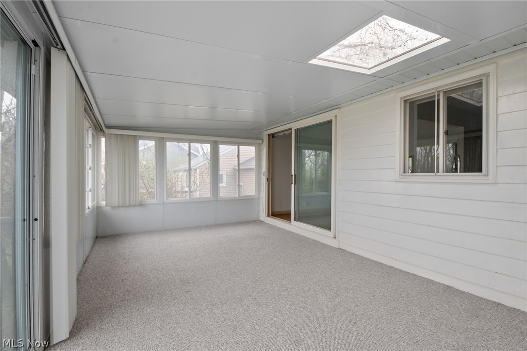 28879 Ridge Road Wickliffe, OH 44092 - Photo 8 of 34 Unfurnished sunroom featuring a skylight
