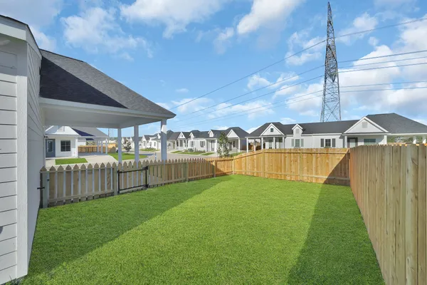 a view of a house with swimming pool and sitting area