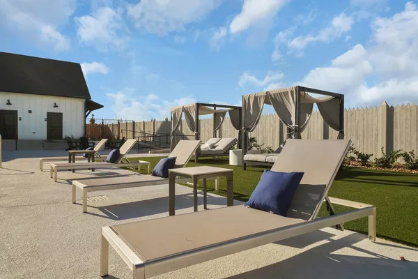 a view of a patio with chairs and tables