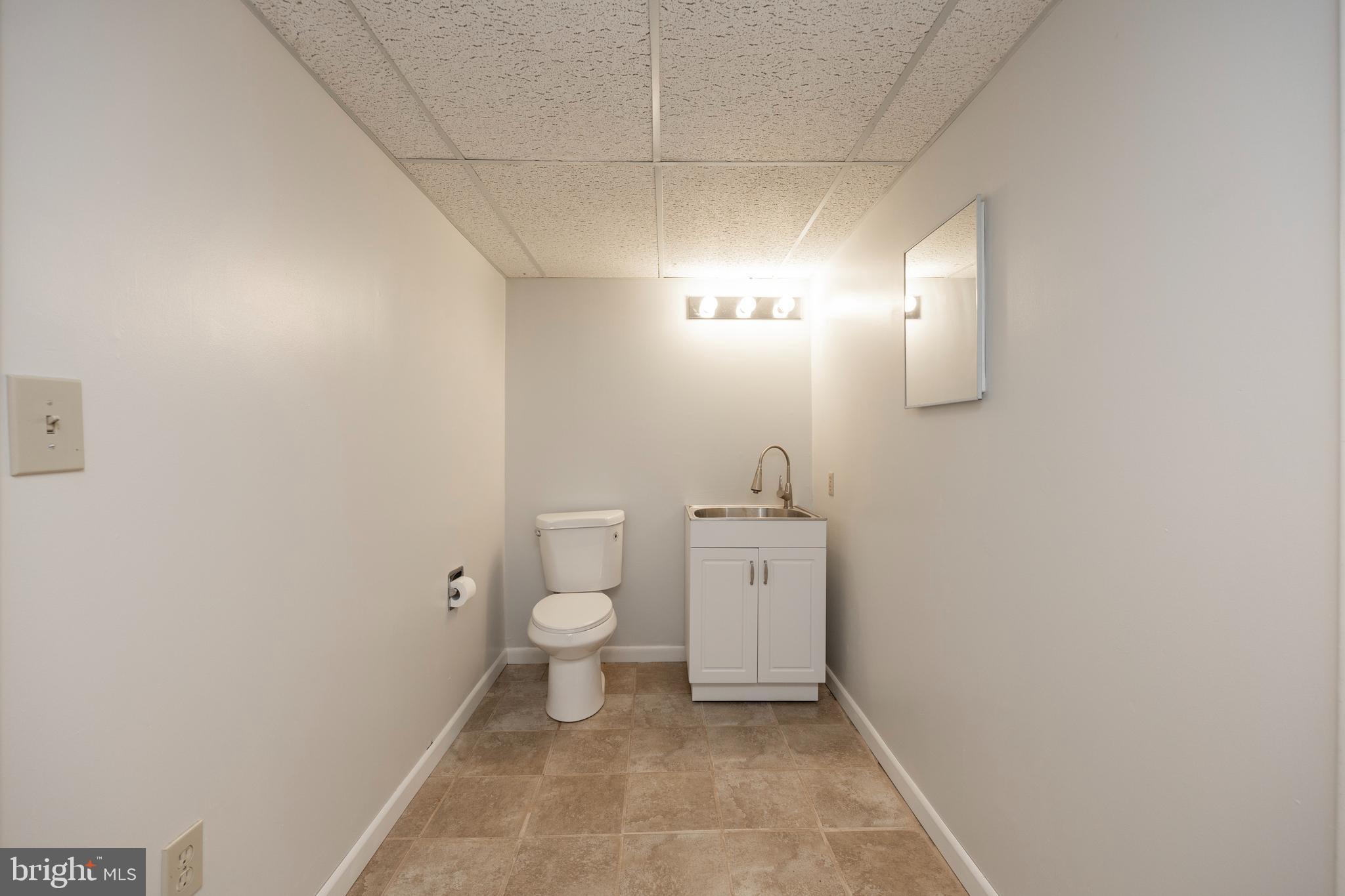 215 Downing Road Downingtown, PA 19335 - Photo 28 of 39 1/2 BA between LL Bonus Room & Unfin. Basement