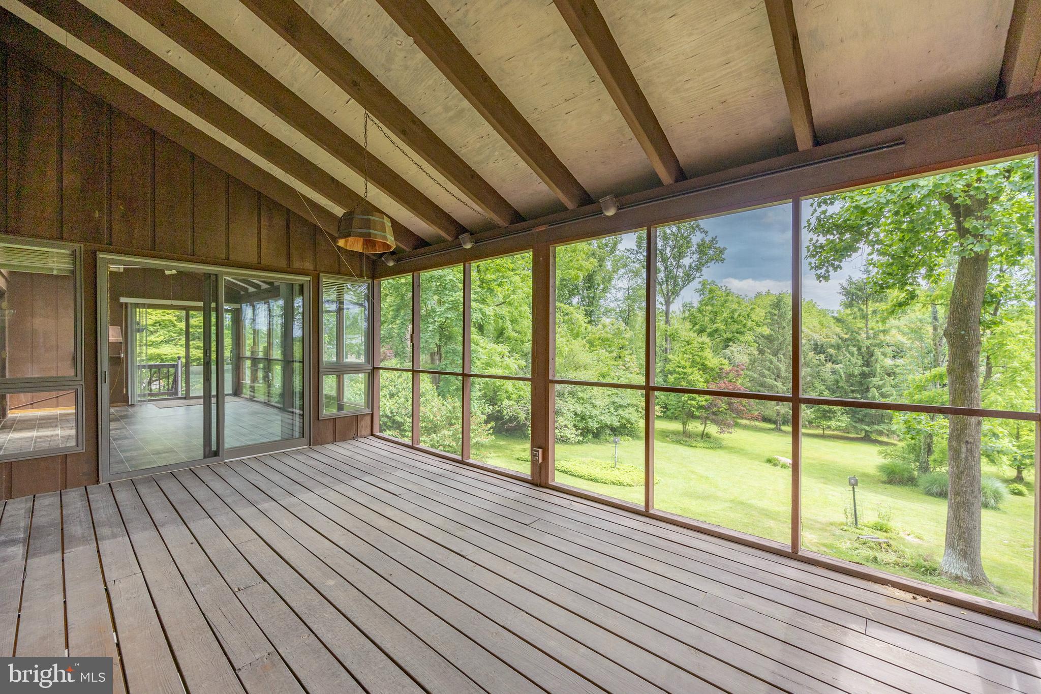 215 Downing Road Downingtown, PA 19335 - Photo 10 of 39 Sunroom opens to Rear Screen Porch