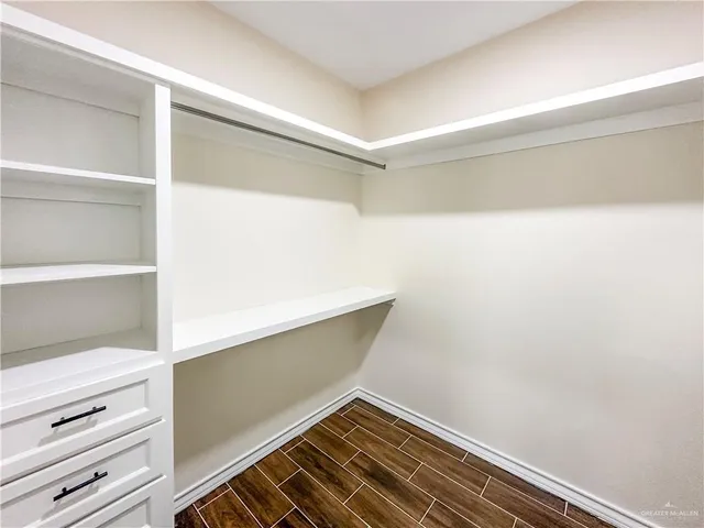 a view of an empty walk in closet