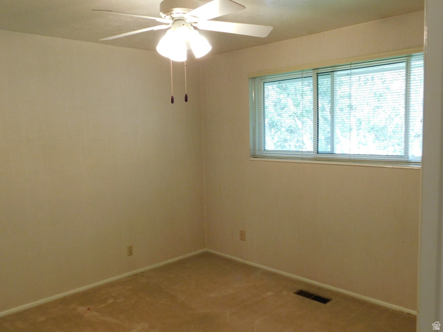 2148 Carolyn Way Bountiful, UT 84010 - Photo 16 of 40 Carpeted room featuring a ceiling fan with integrated lighting, a window with horizontal blinds, and baseboard trim