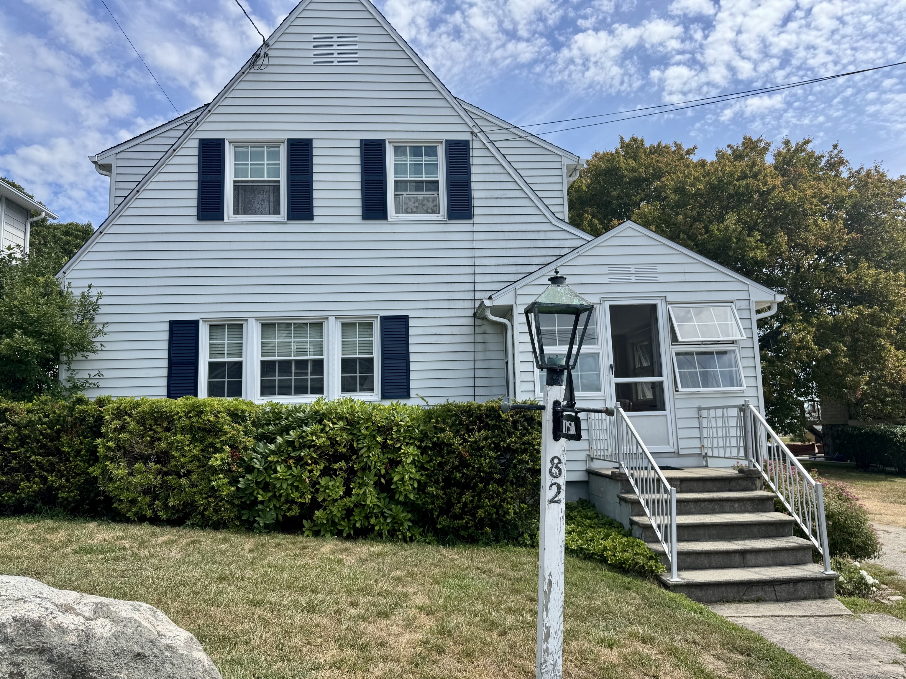 82 Menunketesuck Road Westbrook, CT 06498 - Photo 1 of 1 front view of a house with a yard