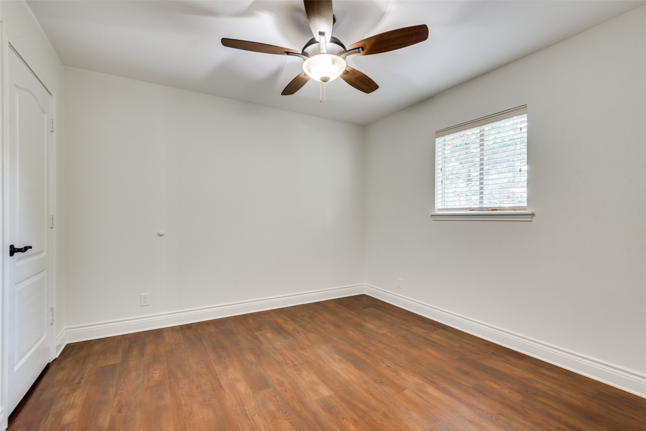 5612 Grover Avenue, Unit 101 Austin, TX 78756 - Photo 5 of 15 an empty room with a window and a fan
