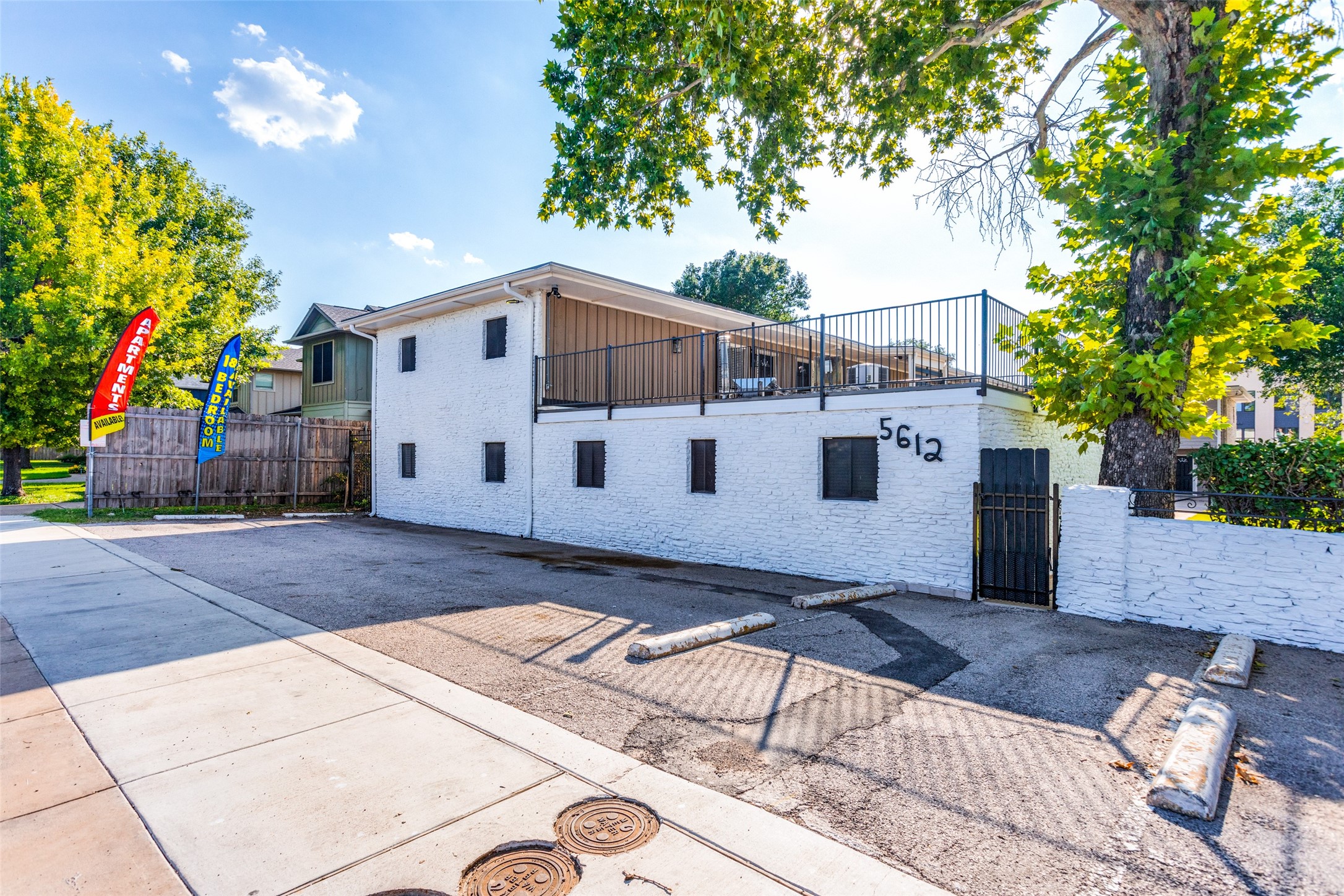 5612 Grover Avenue, Unit 101 Austin, TX 78756 - Photo 10 of 15 a view of a house with a yard