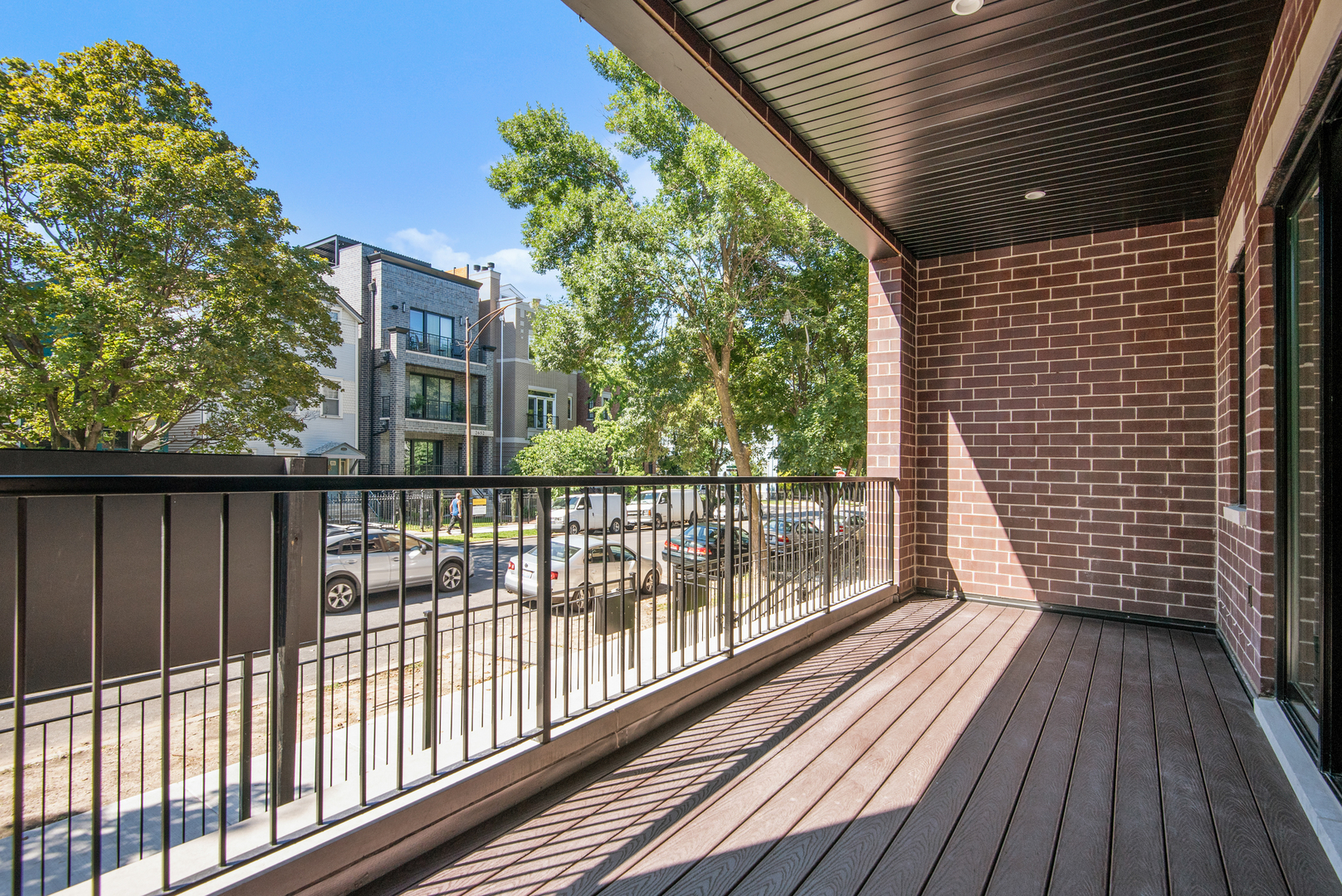 2649 North Racine Avenue, Unit 101 Chicago, IL 60614 - Photo 13 of 13 a view of a balcony with wooden floor