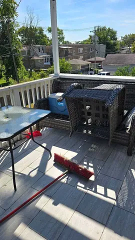 a view of a balcony with furniture