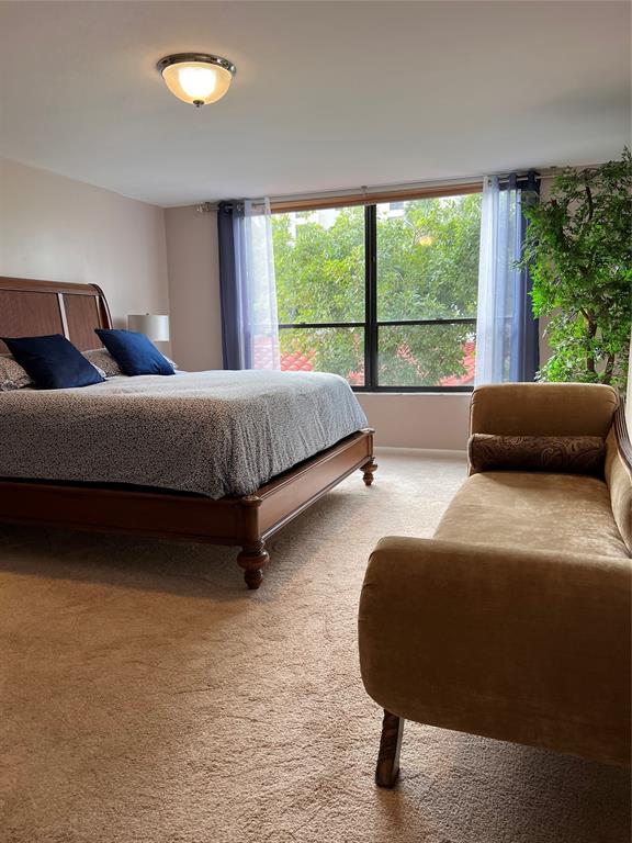 7567 Imperial Drive, Unit 201 Boca Raton, FL 33433 - Photo 23 of 41 a bedroom with bed and glass window