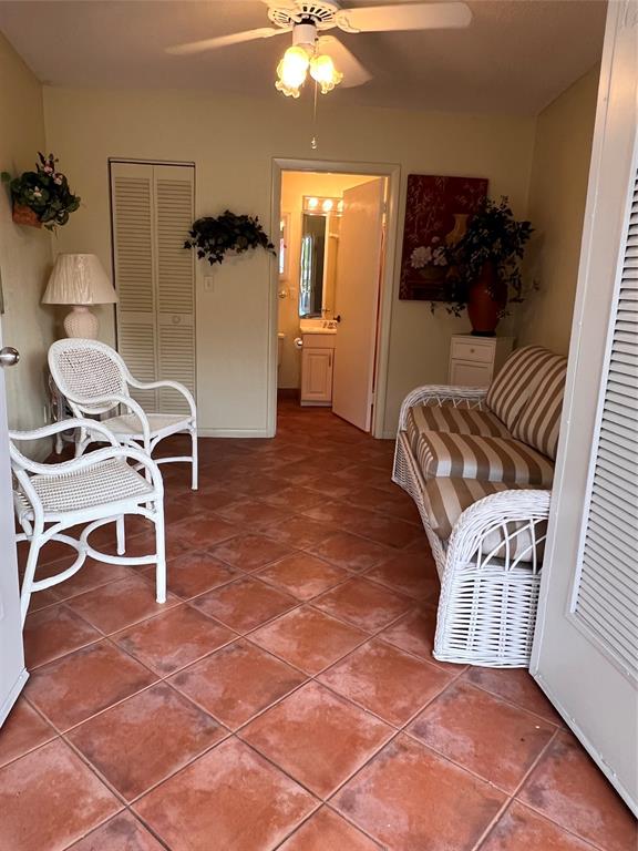 7567 Imperial Drive, Unit 201 Boca Raton, FL 33433 - Photo 32 of 41 a view of a livingroom with furniture and a flat screen tv