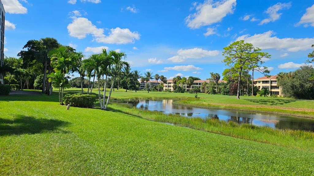 7567 Imperial Drive, Unit 201 Boca Raton, FL 33433 - Photo 37 of 41 a view of a house with a big yard