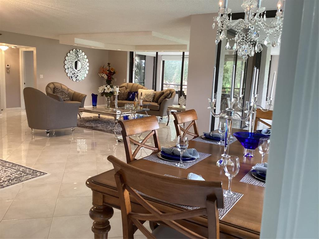 7567 Imperial Drive, Unit 201 Boca Raton, FL 33433 - Photo 7 of 41 a living room with furniture