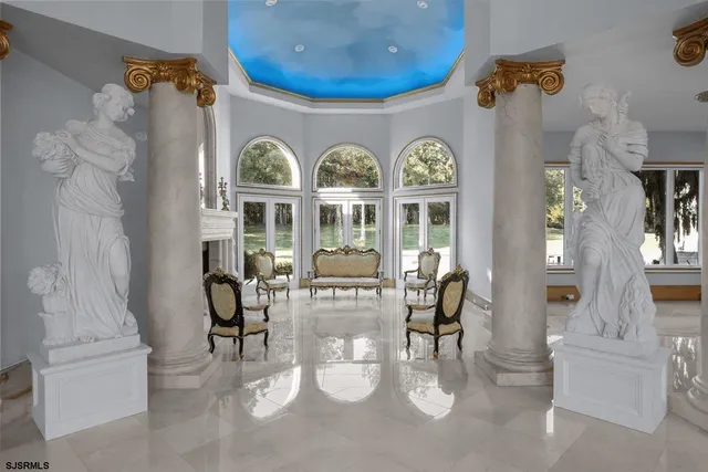 a front view of a house with outdoor seating