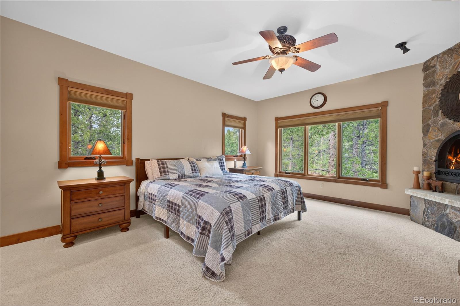 148 County Road Tabernash, CO 80478 - Photo 25 of 45 a spacious bedroom with a bed and a large window