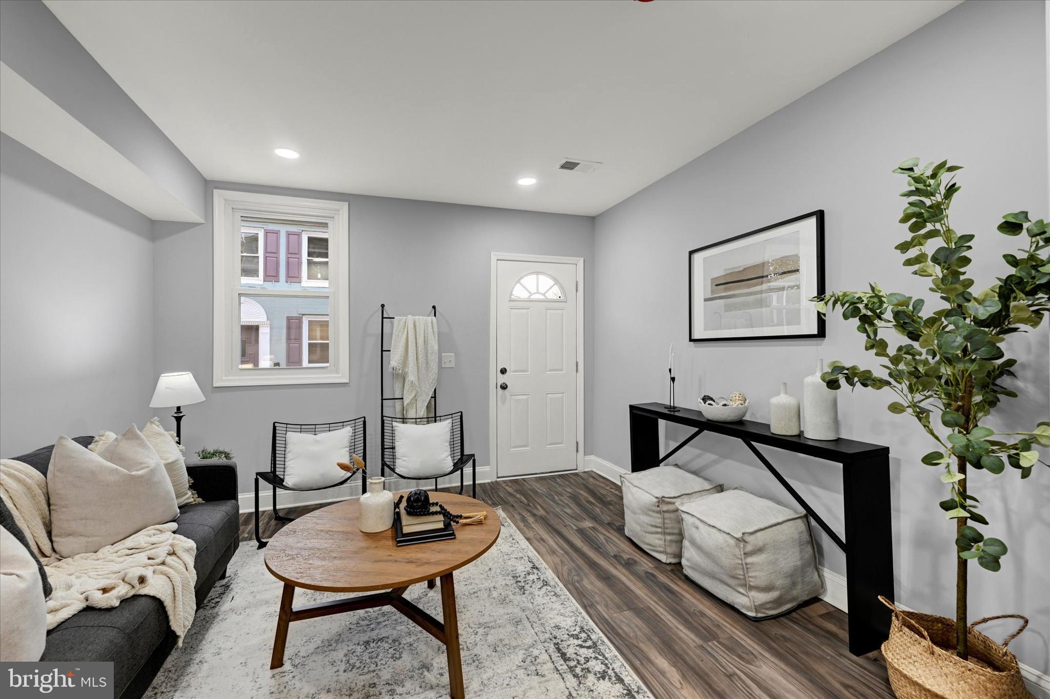 864 Lemmon Street Baltimore, MD 21201 - Photo 4 of 18 a bedroom with furniture and a wooden floor