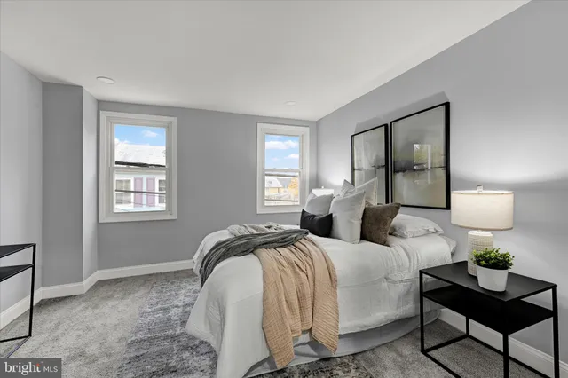 a bedroom with a bed and window