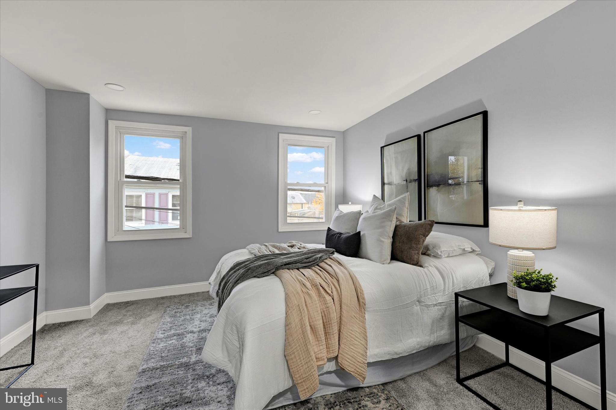 864 Lemmon Street Baltimore, MD 21201 - Photo 9 of 18 a bedroom with a bed and window