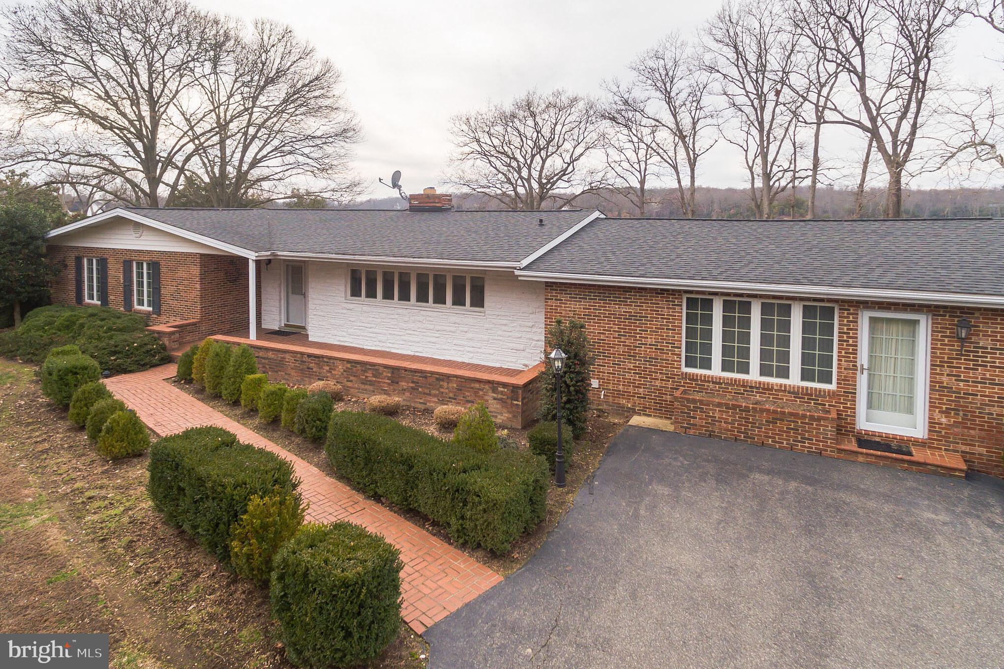 10756 Sawpit Cove Road Lusby, MD 20657 - Photo 2 of 39 The main entrance to this all brick single story.