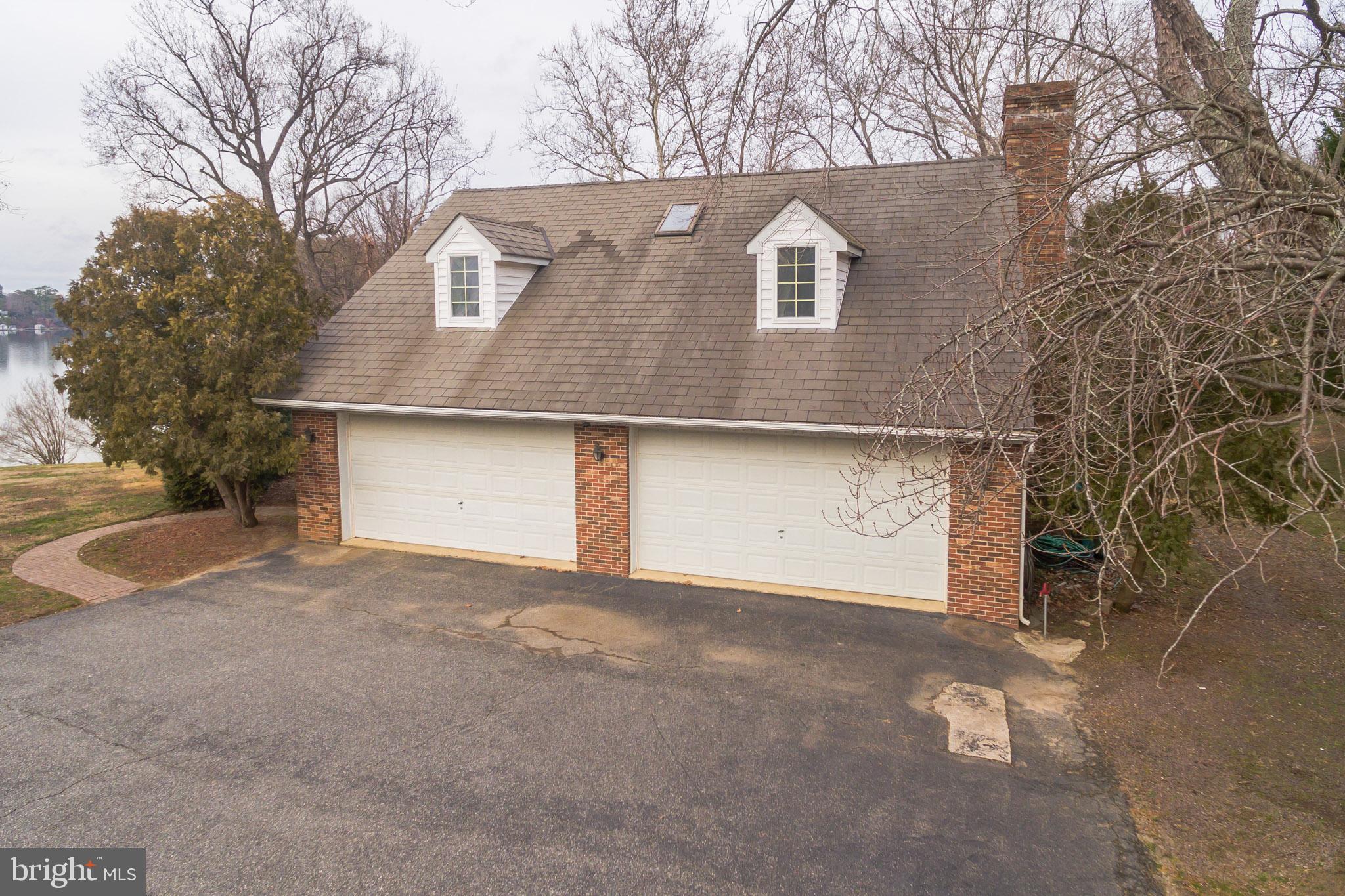 10756 Sawpit Cove Road Lusby, MD 20657 - Photo 35 of 39 4 car garage with bath, office and brick FP.