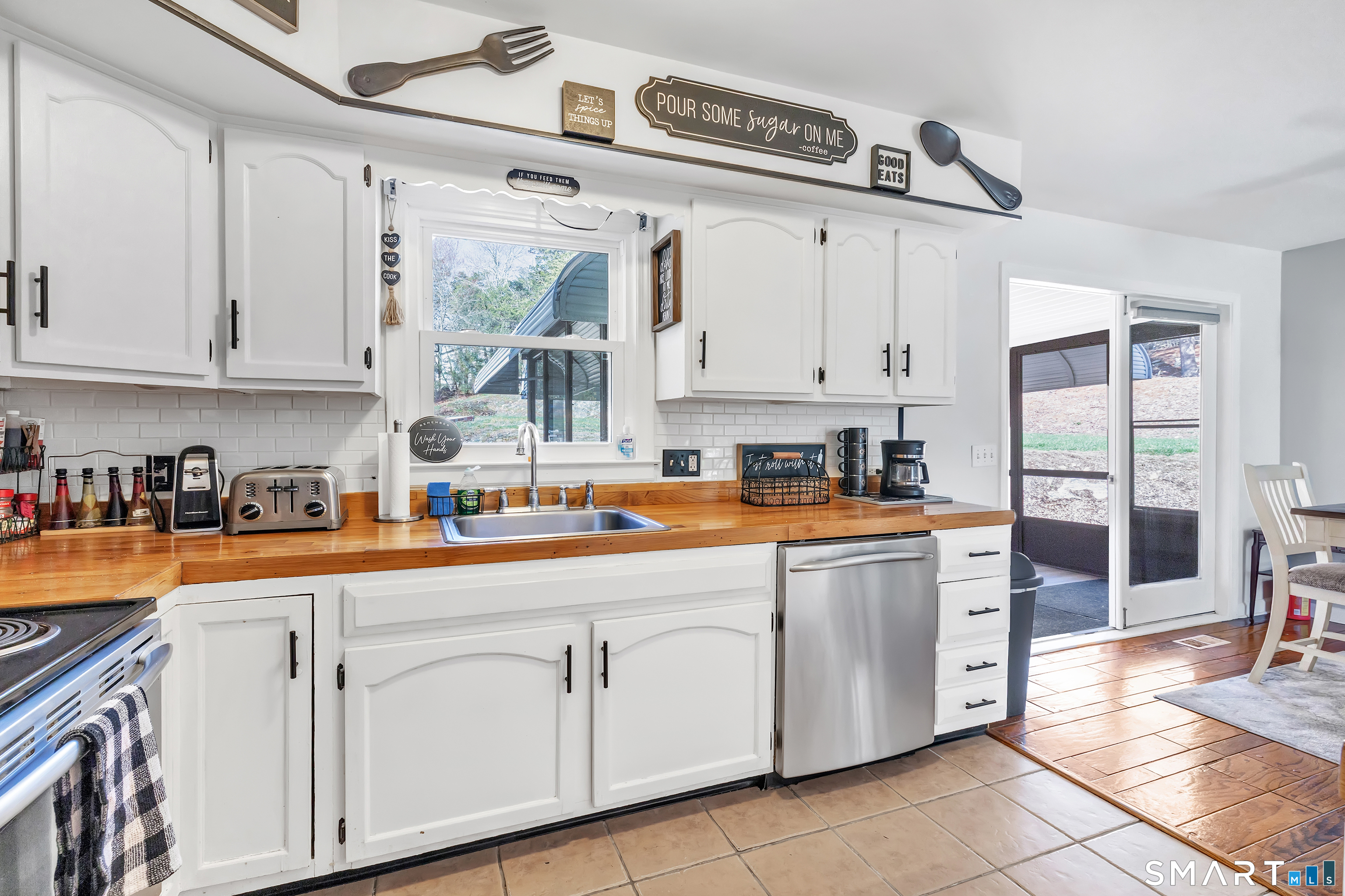 52 Cook Lane Beacon Falls, CT 06403 - Photo 11 of 24 a kitchen with stainless steel appliances granite countertop a sink and cabinets