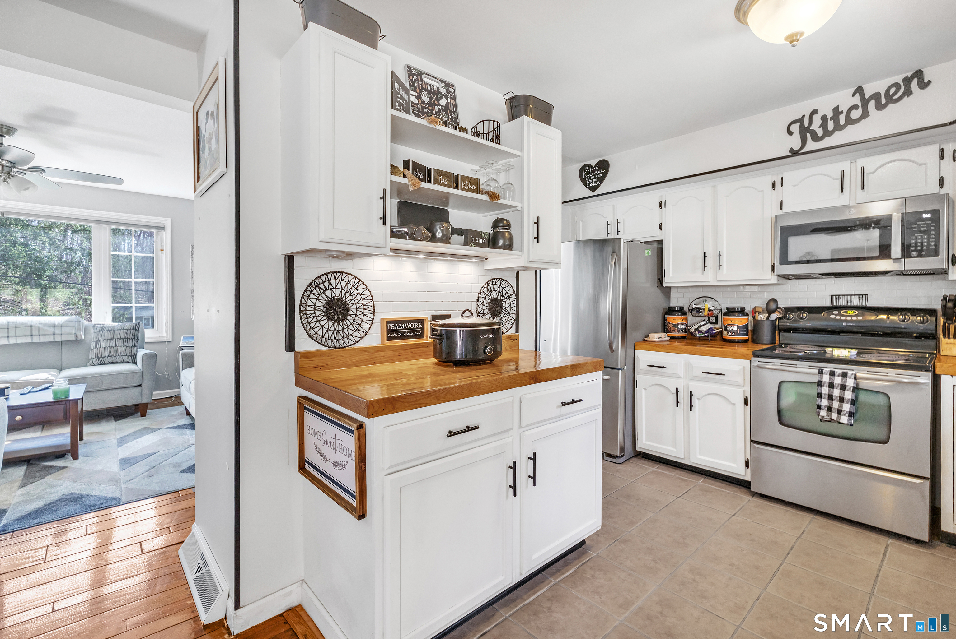52 Cook Lane Beacon Falls, CT 06403 - Photo 13 of 24 a kitchen with stainless steel appliances granite countertop a stove and a sink