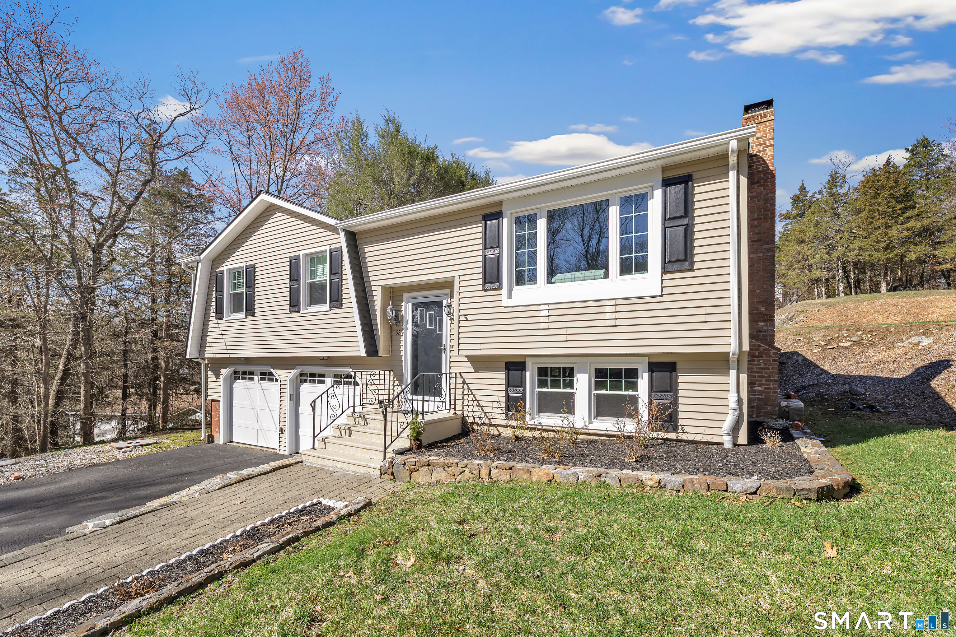 52 Cook Lane Beacon Falls, CT 06403 - Photo 2 of 24 a front view of a house with a yard