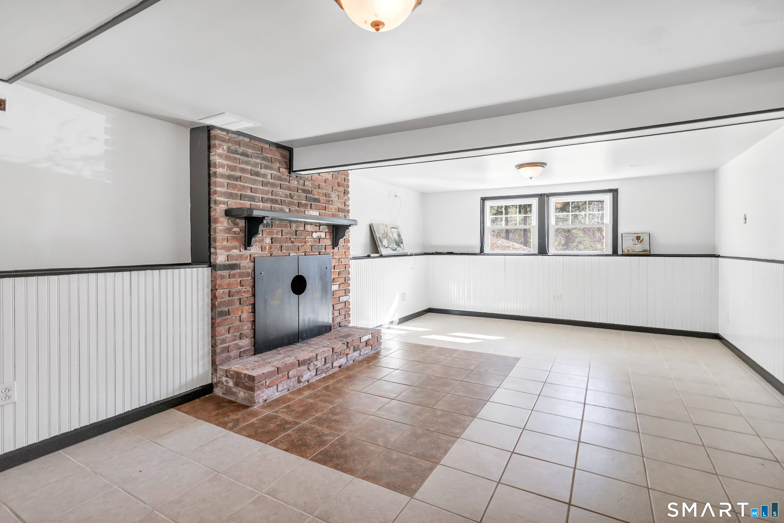 52 Cook Lane Beacon Falls, CT 06403 - Photo 21 of 24 a view of a living room and a window in an empty room