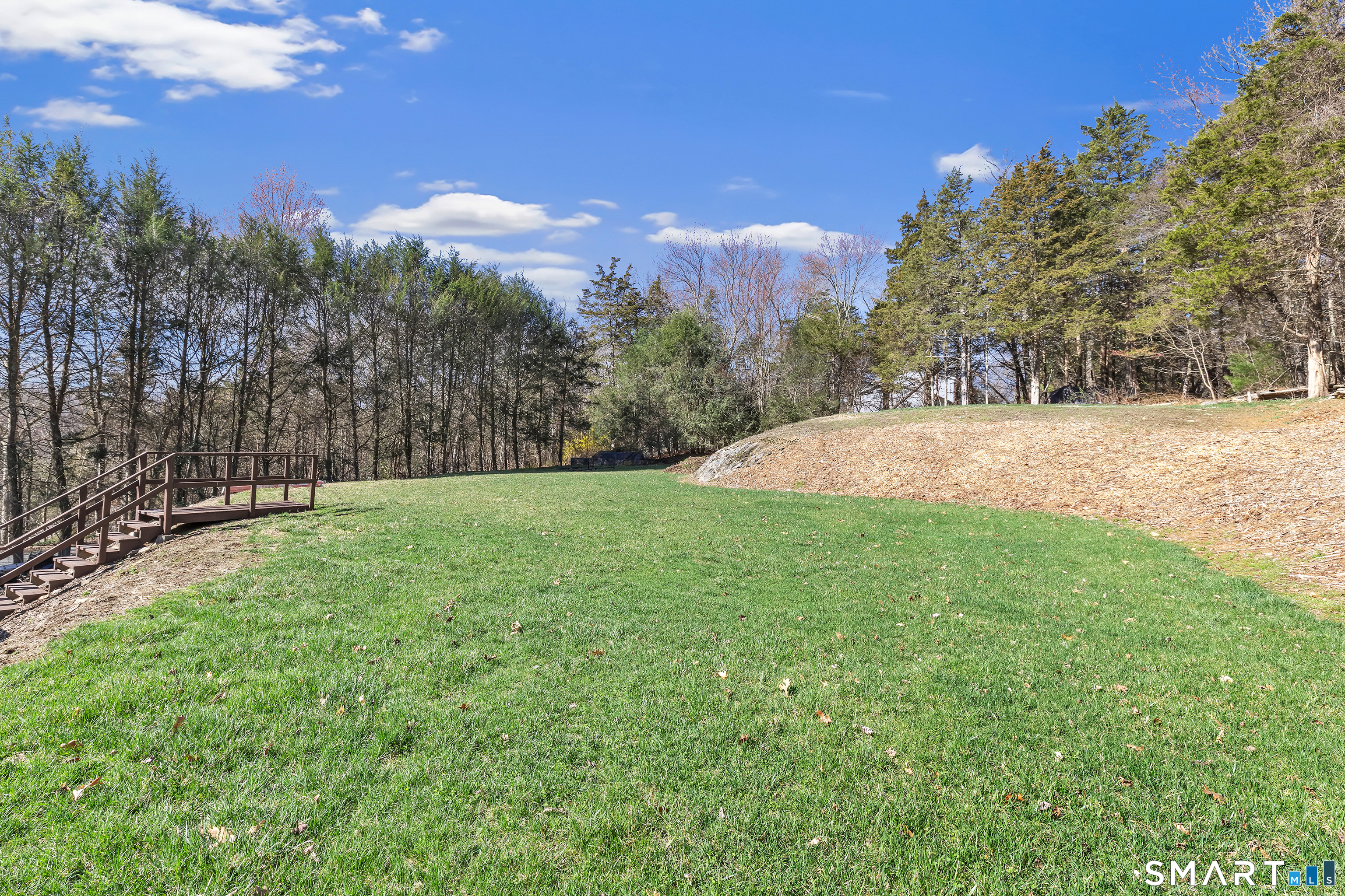 52 Cook Lane Beacon Falls, CT 06403 - Photo 23 of 24 a view of a yard with a house in the background