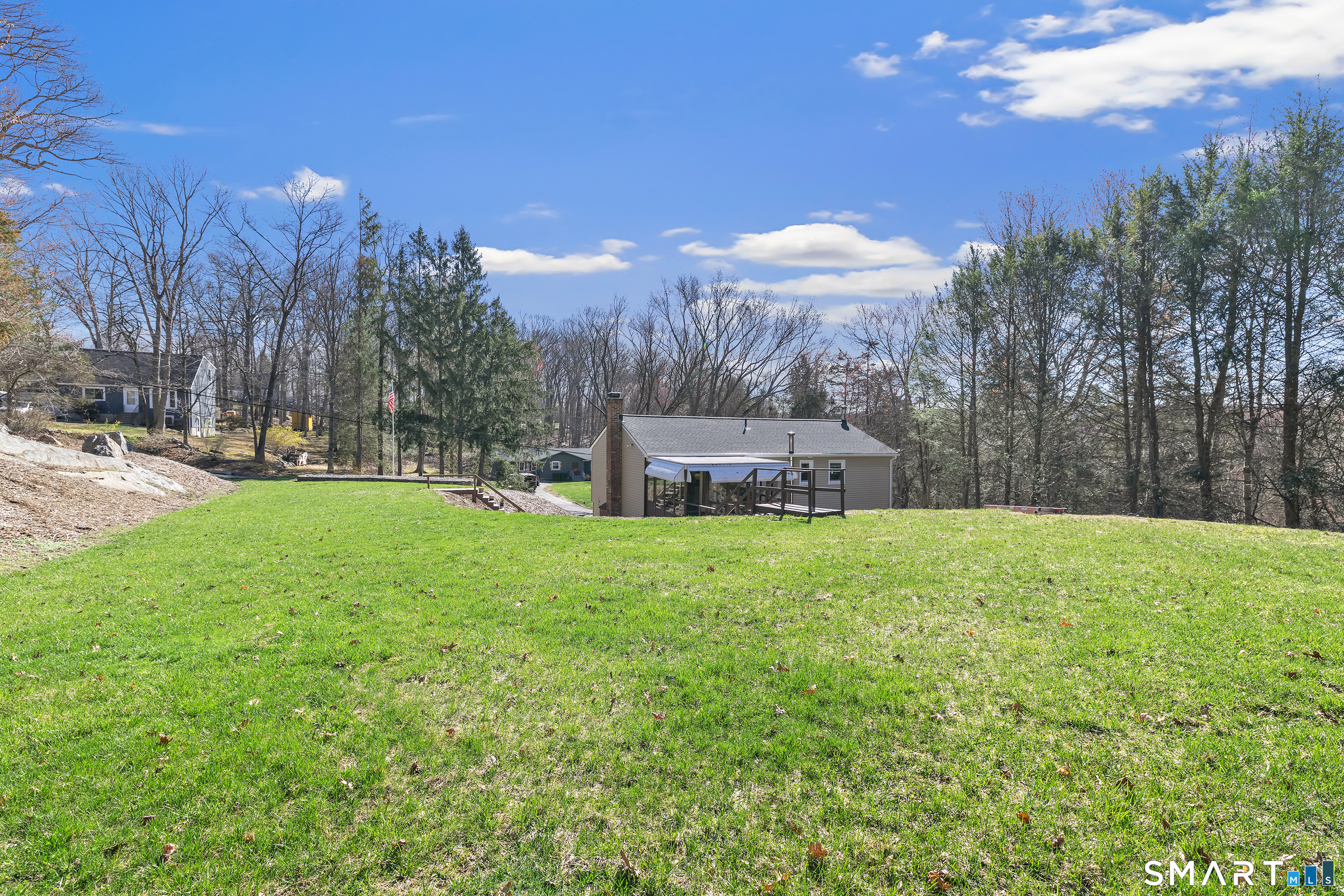 52 Cook Lane Beacon Falls, CT 06403 - Photo 4 of 24 a view of a garden with a building in the background