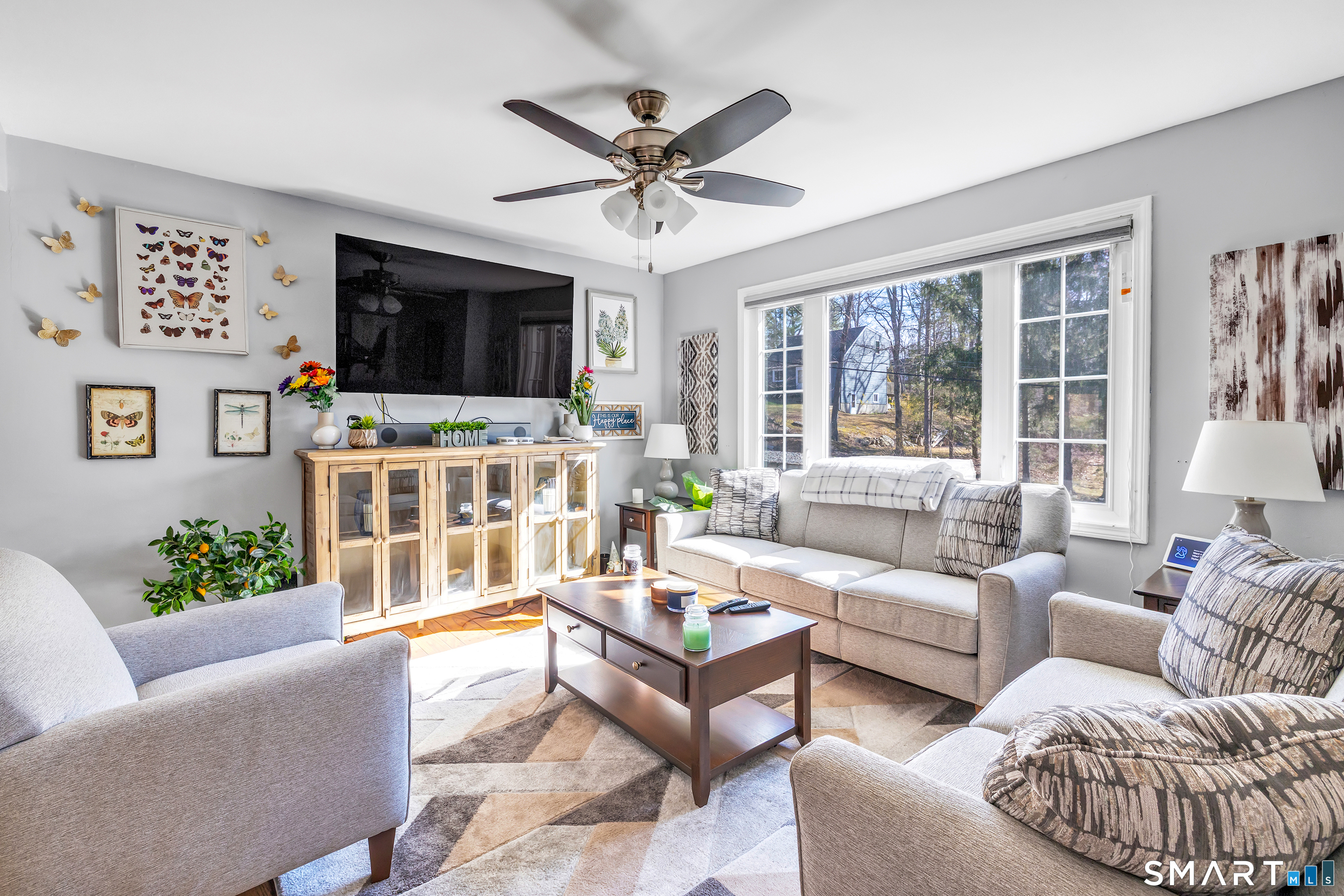 52 Cook Lane Beacon Falls, CT 06403 - Photo 6 of 24 a living room with furniture a flat screen tv and a window
