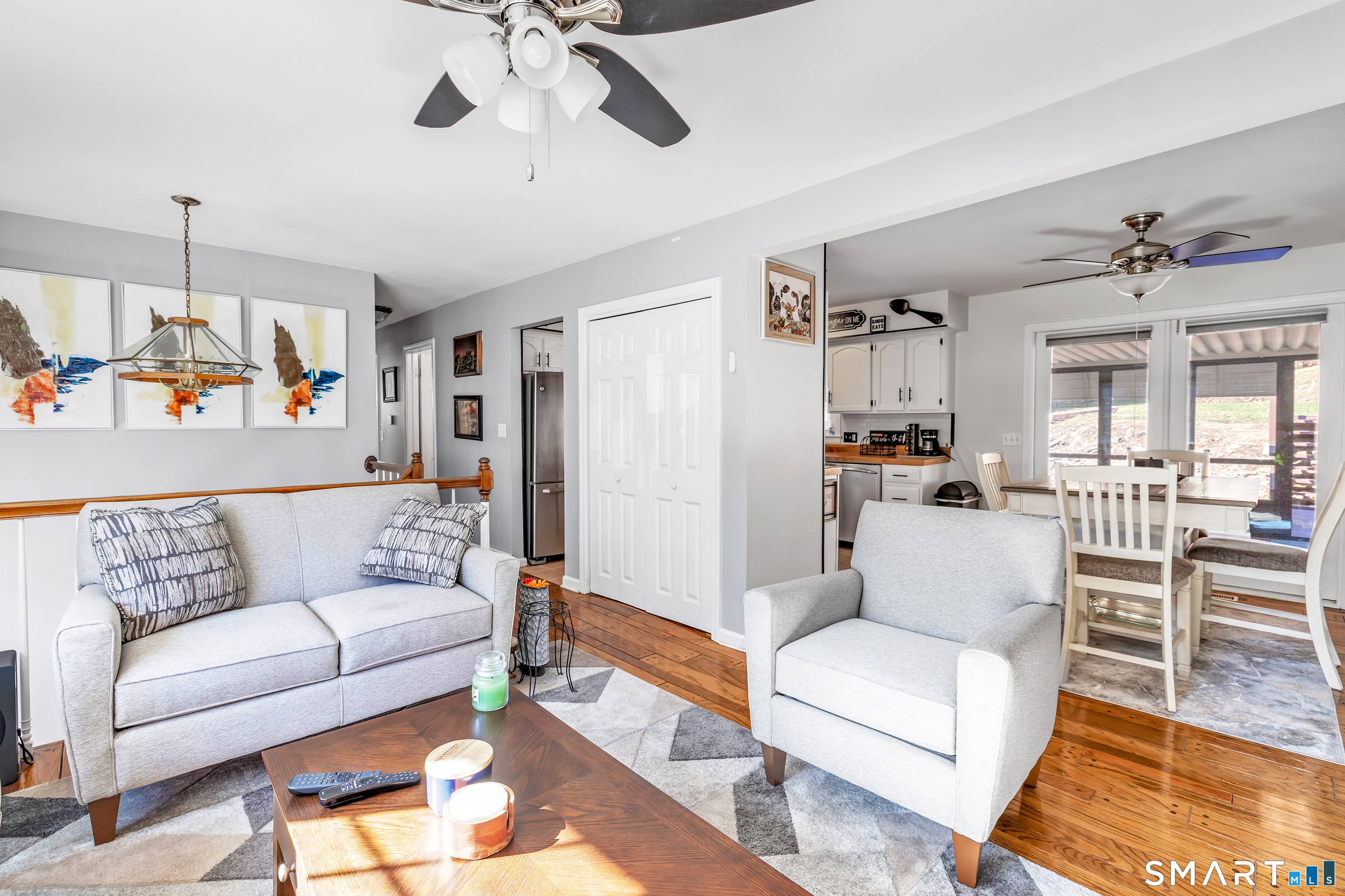 52 Cook Lane Beacon Falls, CT 06403 - Photo 7 of 24 a living room with furniture and a chandelier