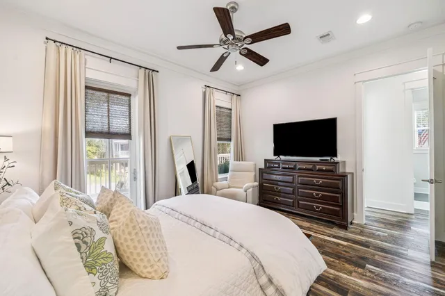 a bathroom with a granite countertop sink vanity mirror and toilet