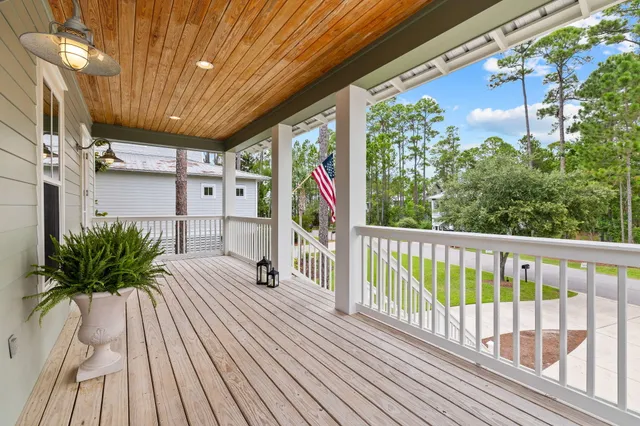a view of a bedroom with wooden floor and a window