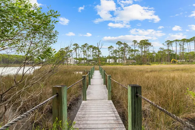 an aerial view of a swimming pool patio and outdoor seating