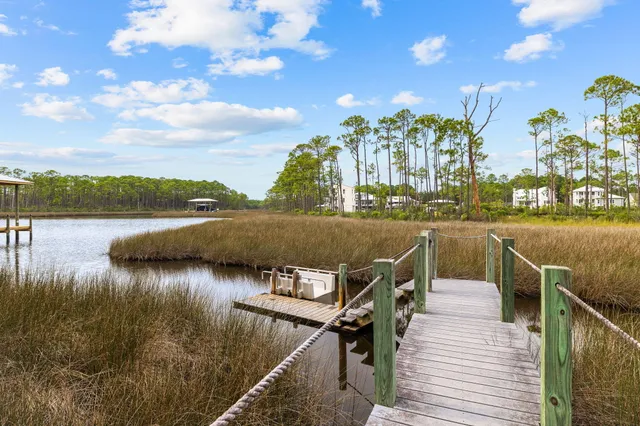 a view of swimming pool with outdoor seating and trees