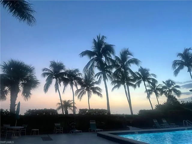 an aerial view of beach and swimming pool