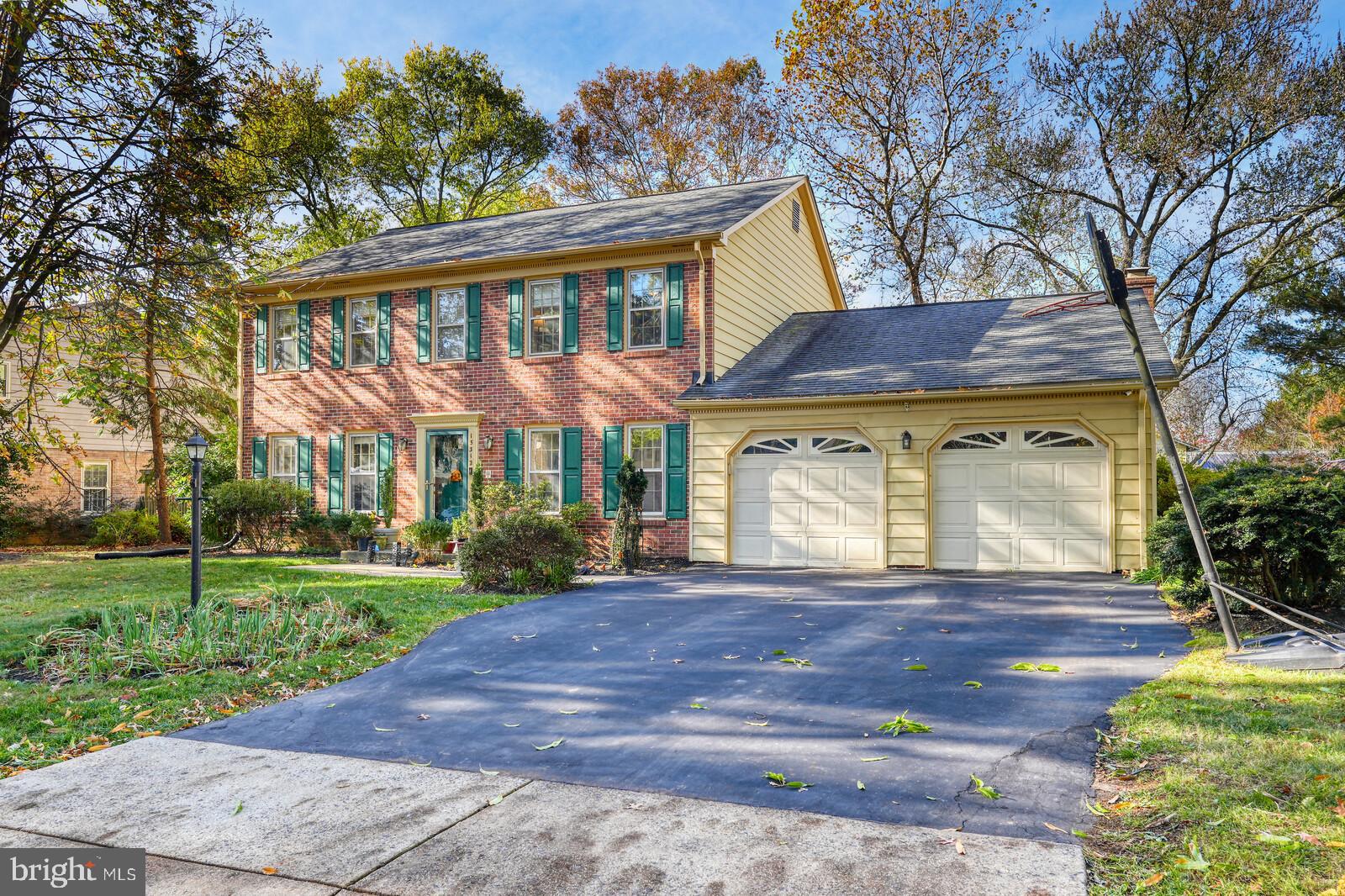 15312 Durant Street Silver Spring, MD 20905 - Photo 2 of 64 a front view of a house with a yard and garage