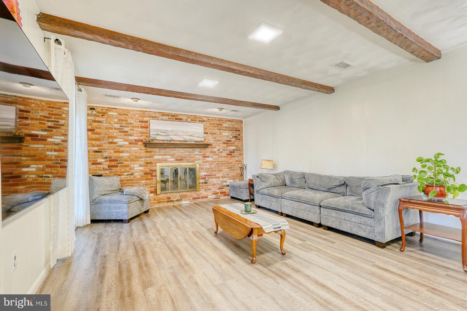 15312 Durant Street Silver Spring, MD 20905 - Photo 27 of 64 a living room with furniture and wooden floor
