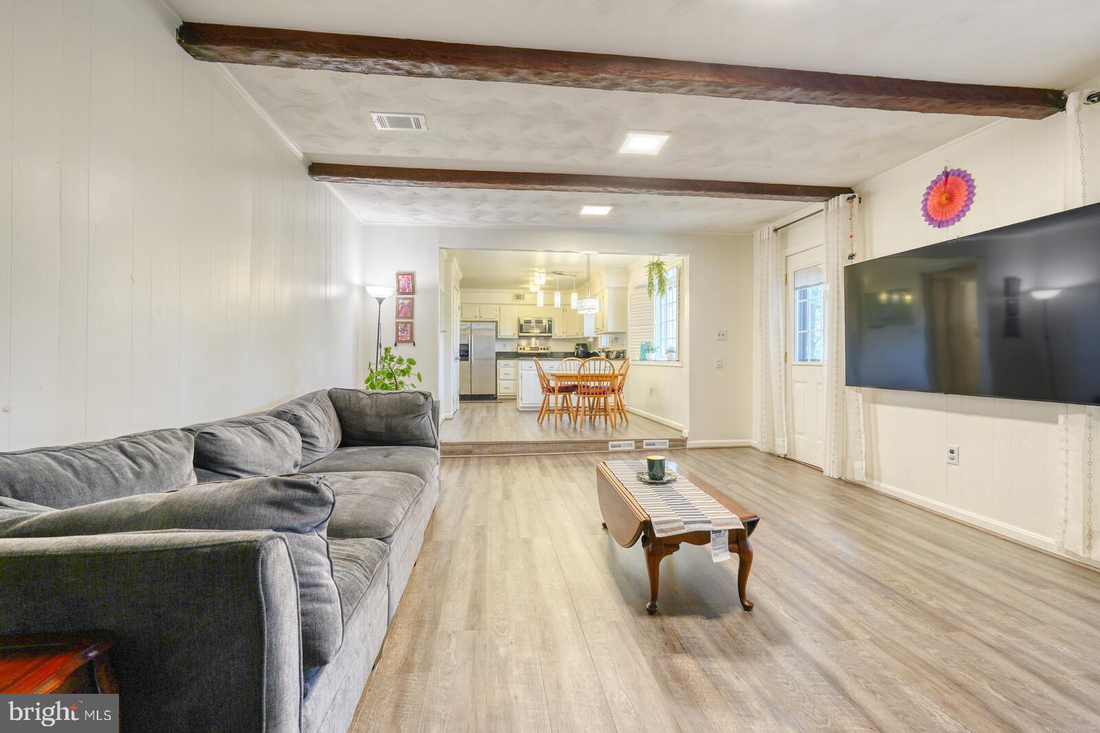 15312 Durant Street Silver Spring, MD 20905 - Photo 29 of 64 a living room with furniture and a flat screen tv