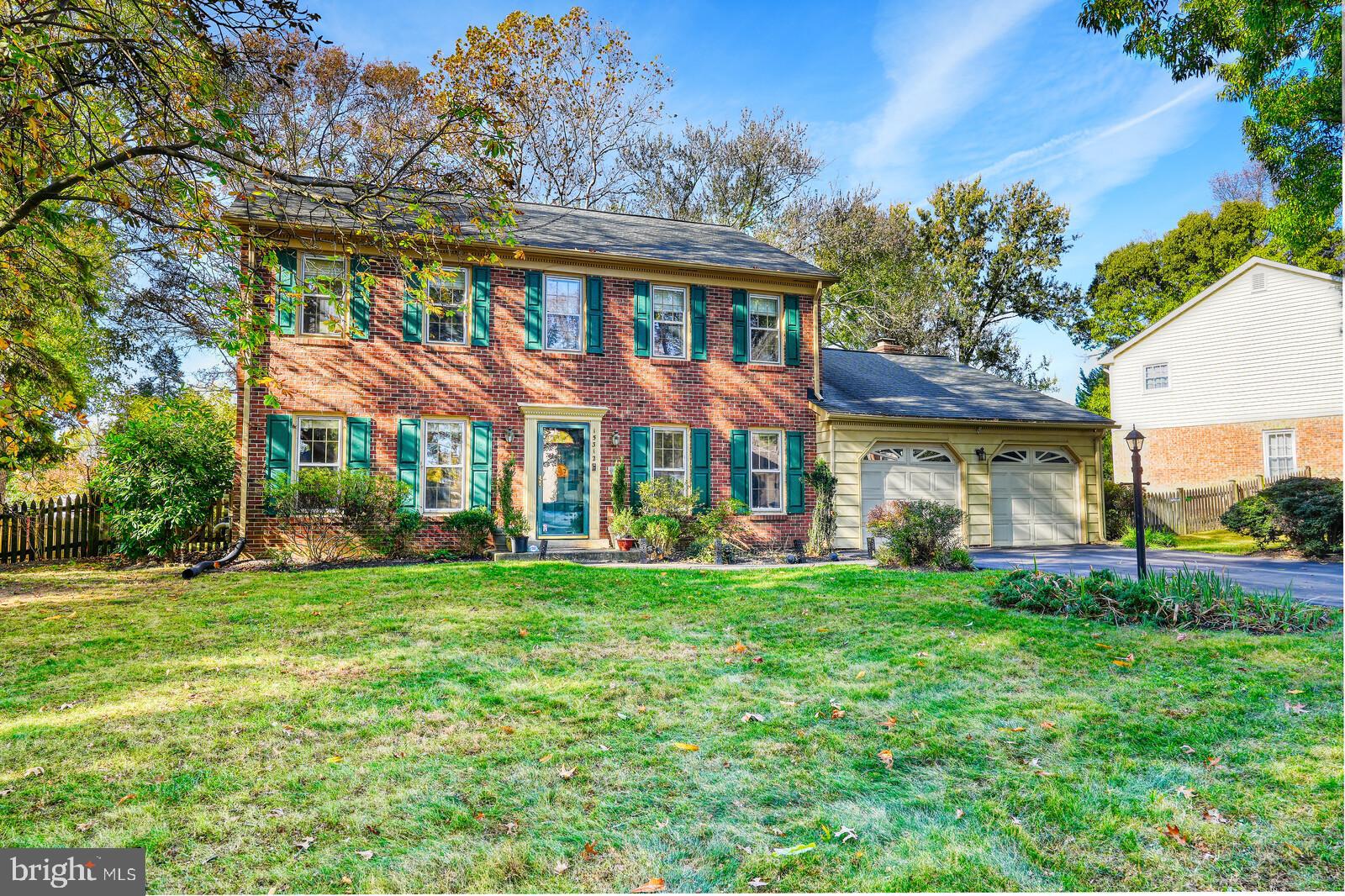 15312 Durant Street Silver Spring, MD 20905 - Photo 3 of 64 a front view of a house with a garden