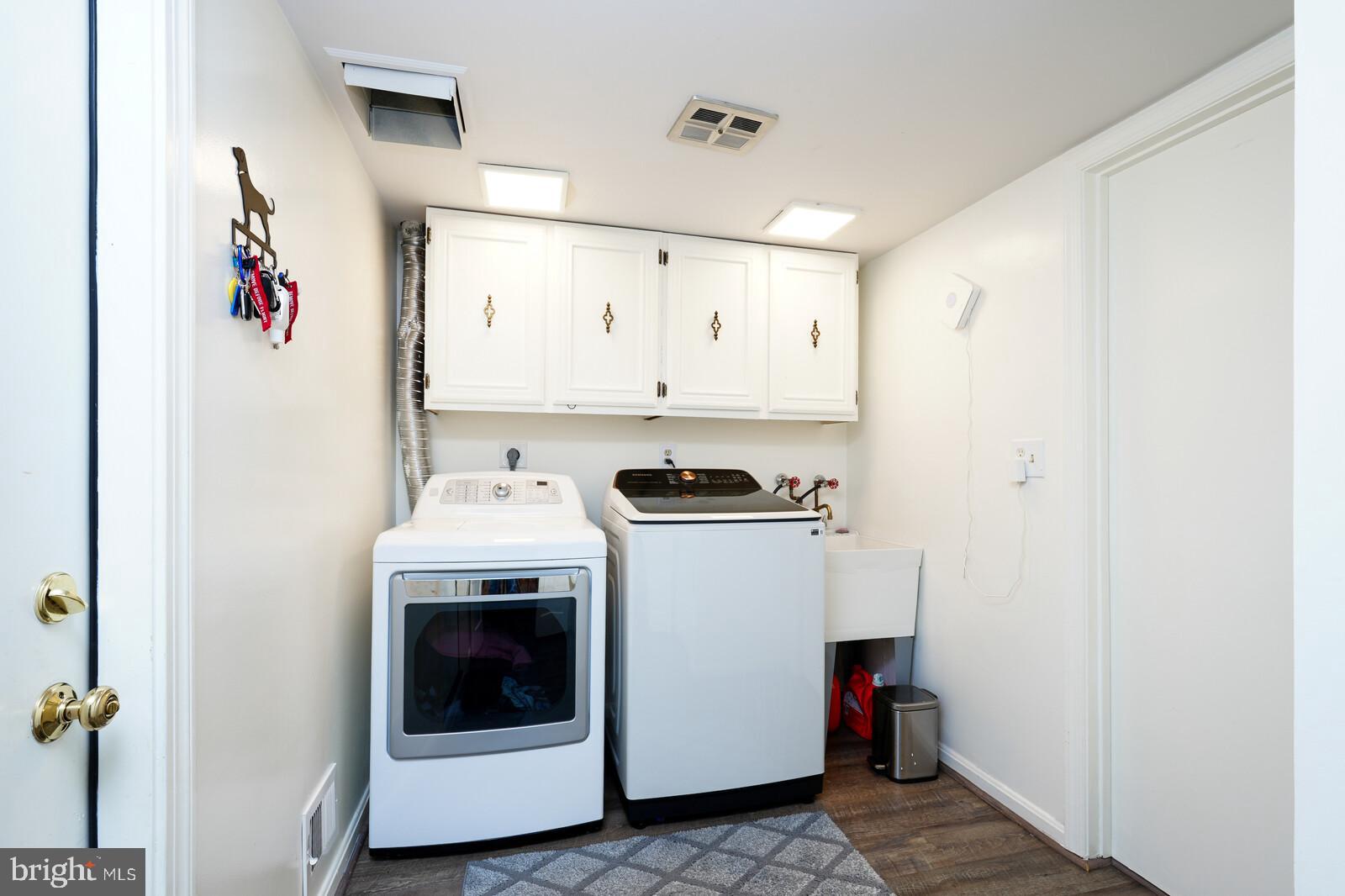 15312 Durant Street Silver Spring, MD 20905 - Photo 33 of 64 a utility room with dryer and washer