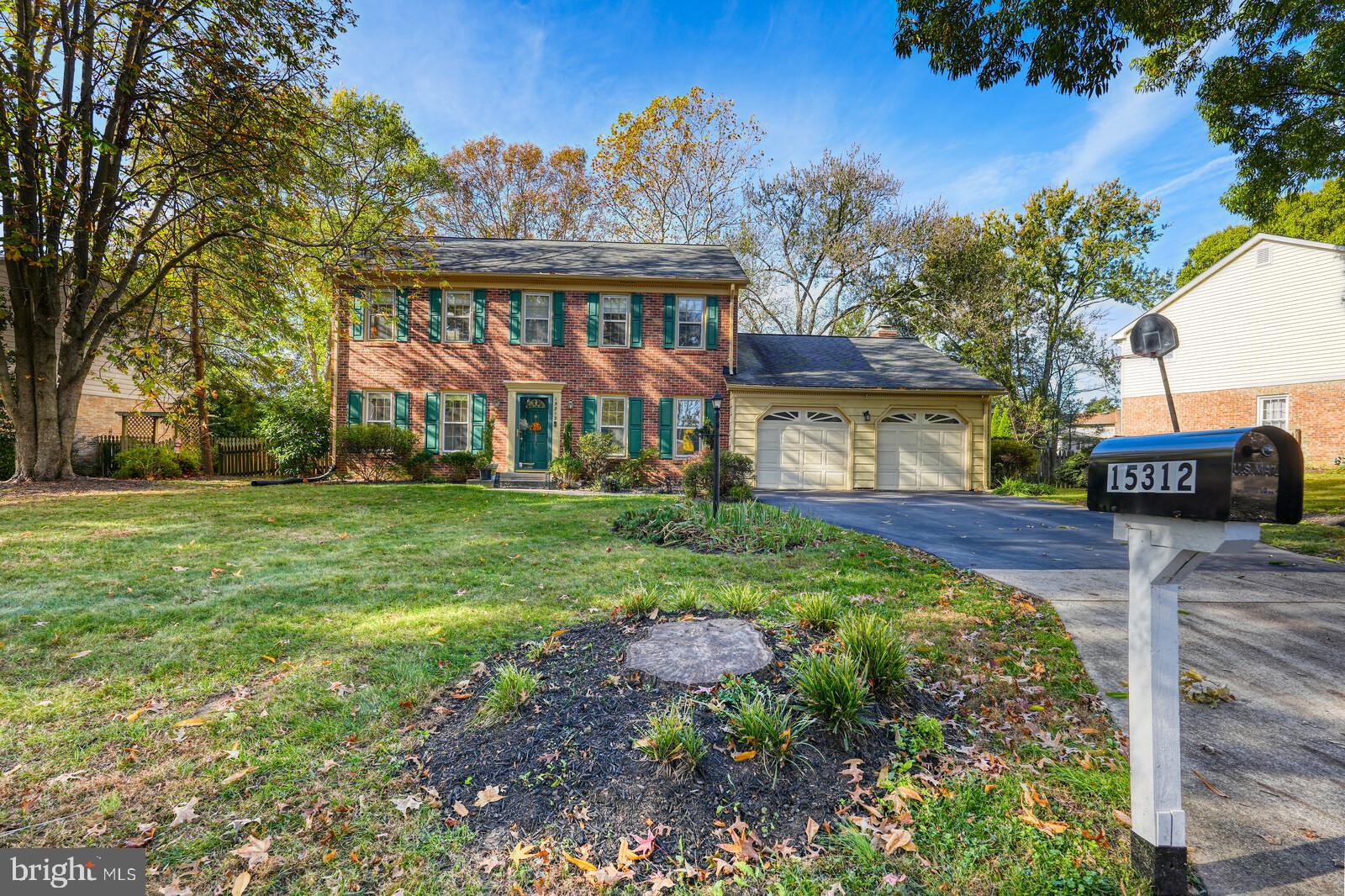 15312 Durant Street Silver Spring, MD 20905 - Photo 4 of 64 a front view of a house with garden