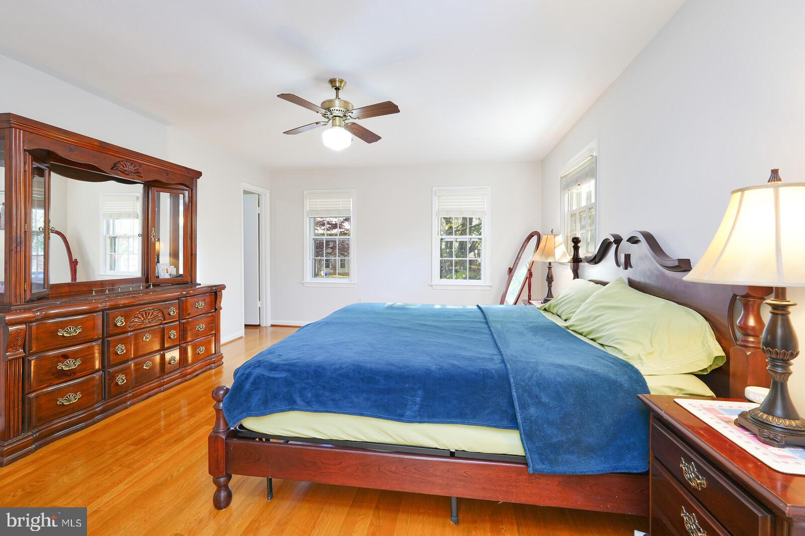15312 Durant Street Silver Spring, MD 20905 - Photo 46 of 64 a bedroom with a large bed and a dresser