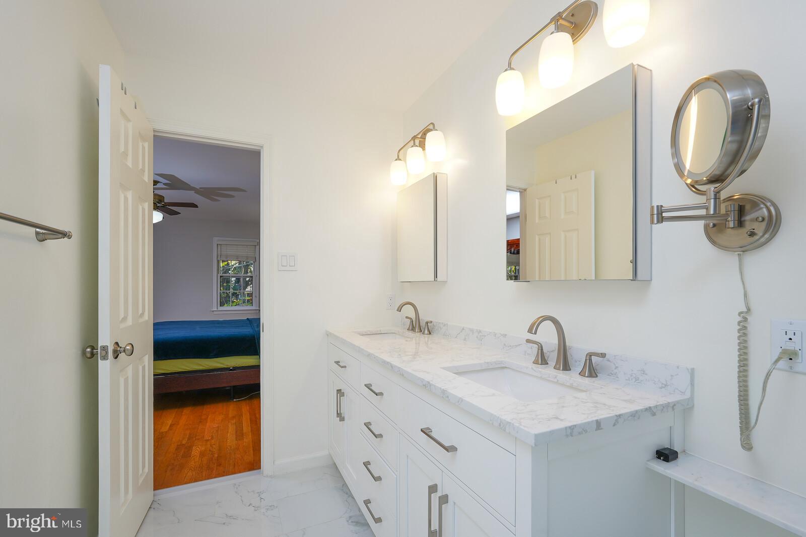 15312 Durant Street Silver Spring, MD 20905 - Photo 49 of 64 a bathroom with a sink and a mirror