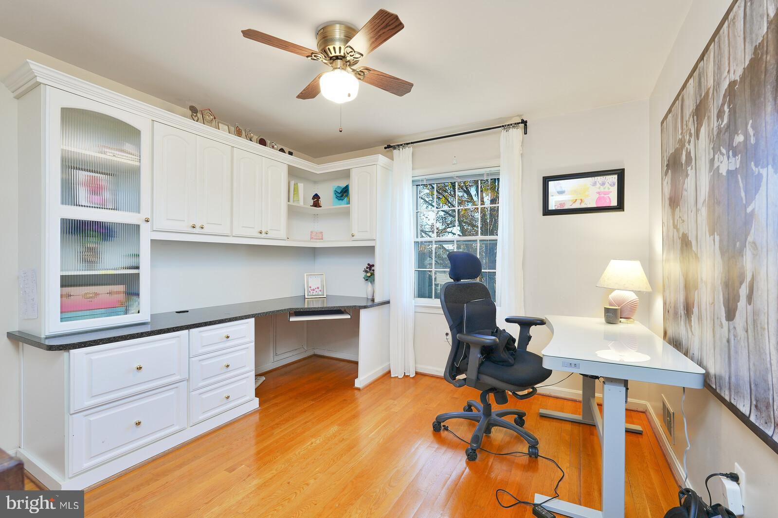15312 Durant Street Silver Spring, MD 20905 - Photo 50 of 64 a view of a workspace with furniture and a window