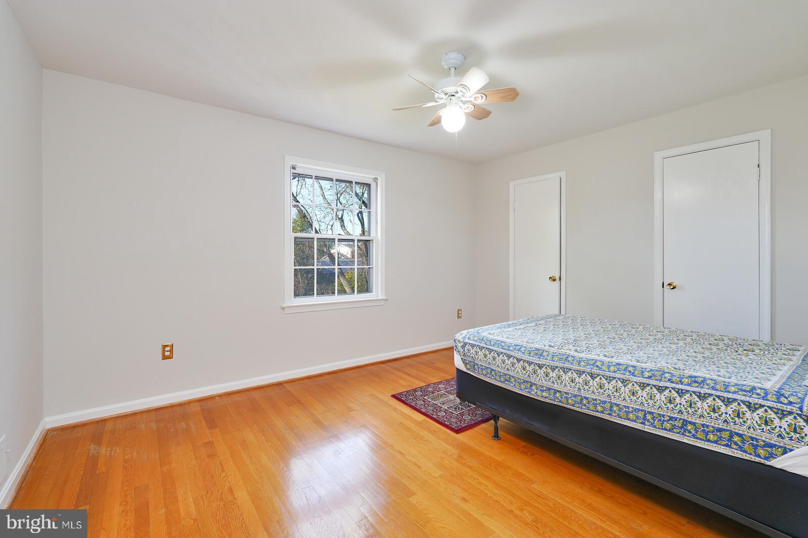 15312 Durant Street Silver Spring, MD 20905 - Photo 51 of 64 a bedroom with a bed and window