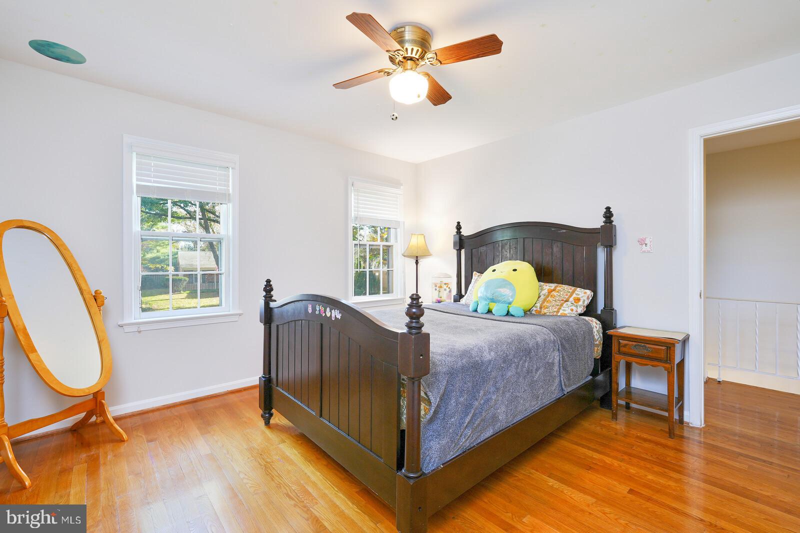 15312 Durant Street Silver Spring, MD 20905 - Photo 53 of 64 a bedroom with a bed and a chandelier