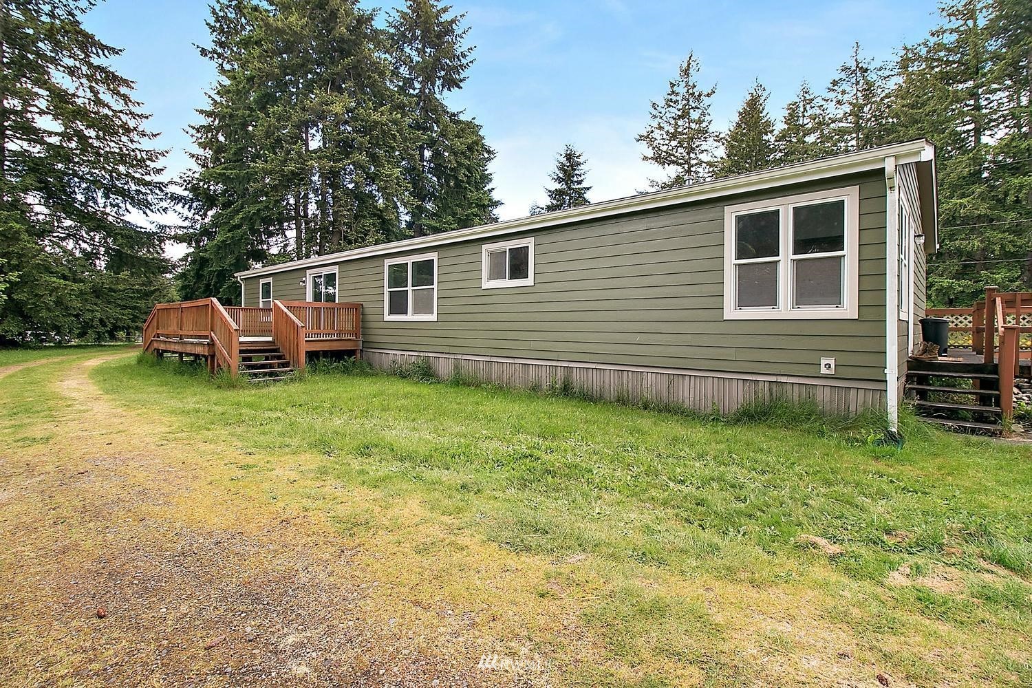 5038 186th Lane Southwest Rochester, WA 98579 - Photo 29 of 36 a backyard of a house with seating space