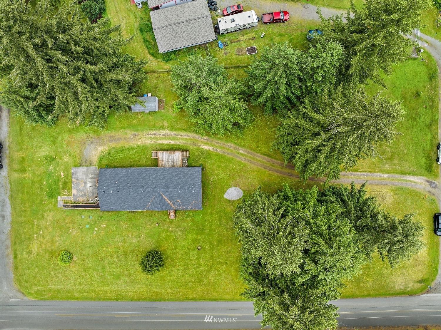 5038 186th Lane Southwest Rochester, WA 98579 - Photo 34 of 36 a view of a garden with an outdoor space